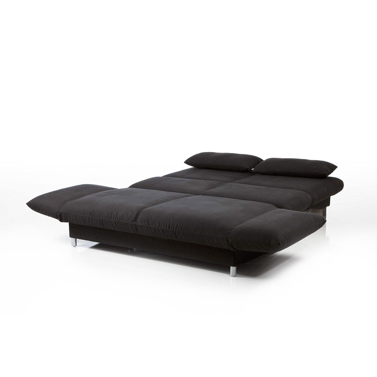 Ein zu einer Liegefläche ausgeklapptes Bettsofa in einem schwarzen Stoff.