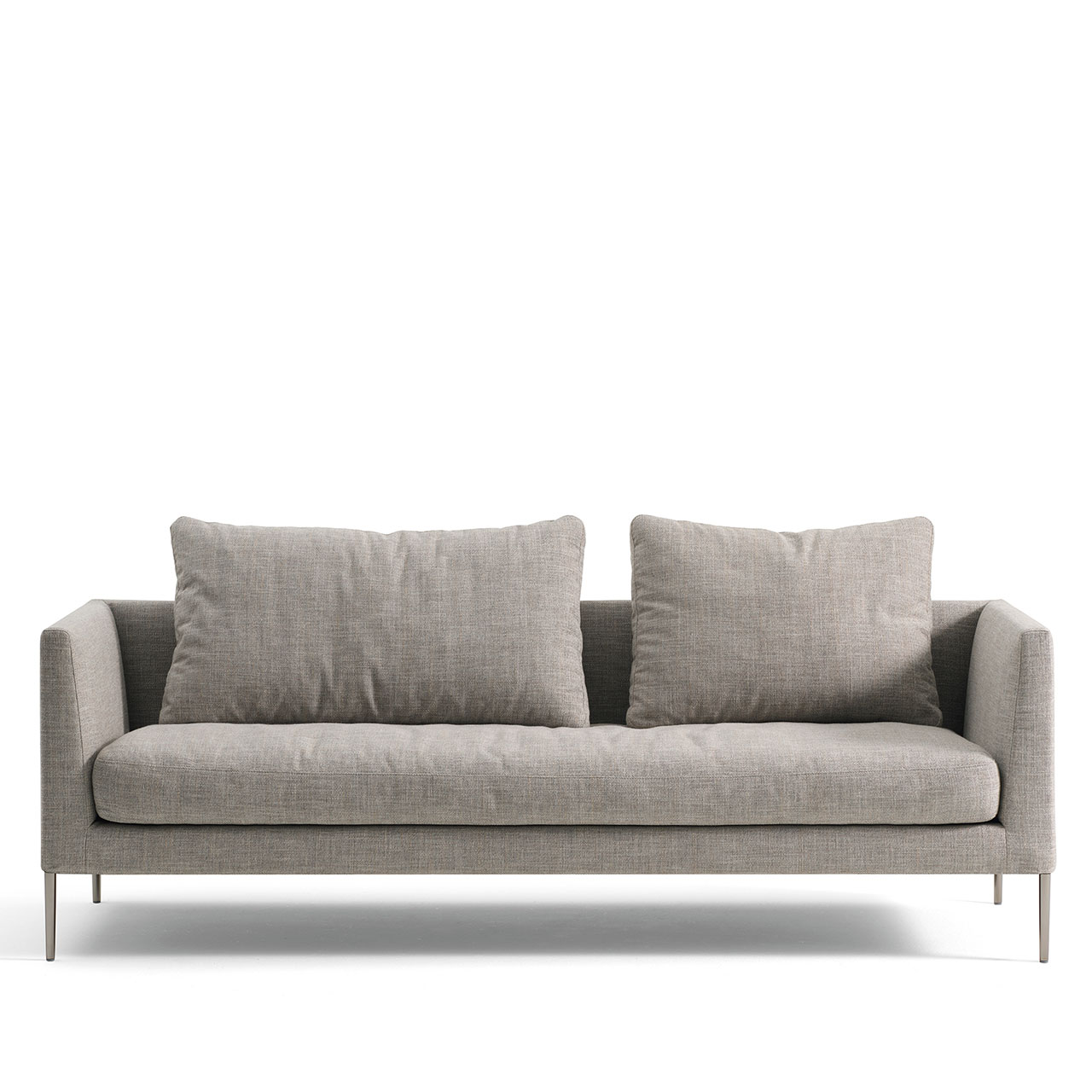 Breites Sofa aus grauem Stoff auf hohen Füßen mit einem breiten und einem normalen Kissen