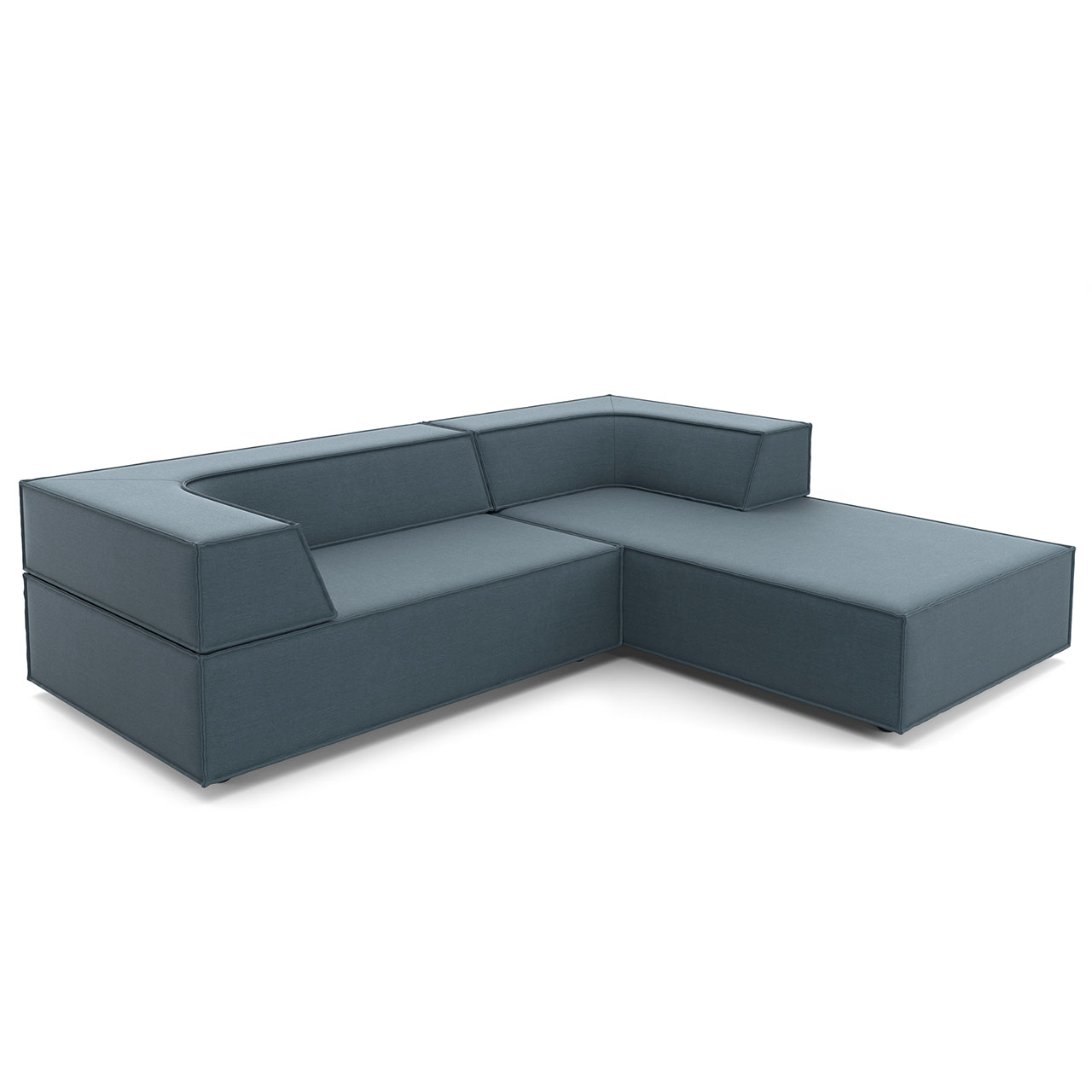 Polsterecke aus blauem Stoff: Links kürzeres Element mit längerer Rückenlehne als Sitzfläche. Rechts das längere Element mit kurzer Rückenlehne dient als Ottomane.