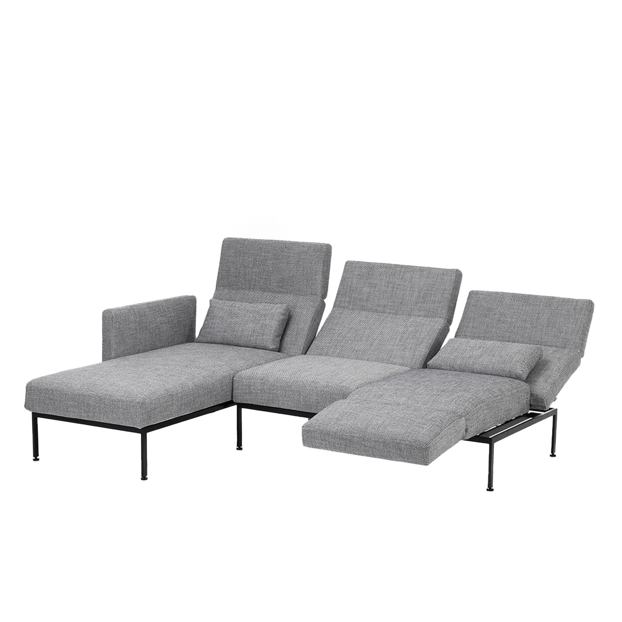 Eckgarnitur der Serie roro medium spring mit Longchair links und Anstellsofa rechts in grauem Stoff.